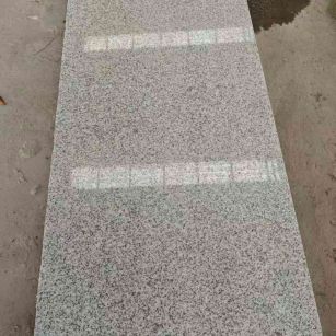 云浮芝麻白光面毛板